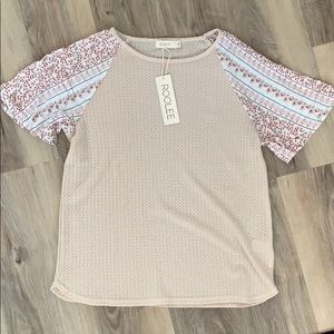 roolee top with tags